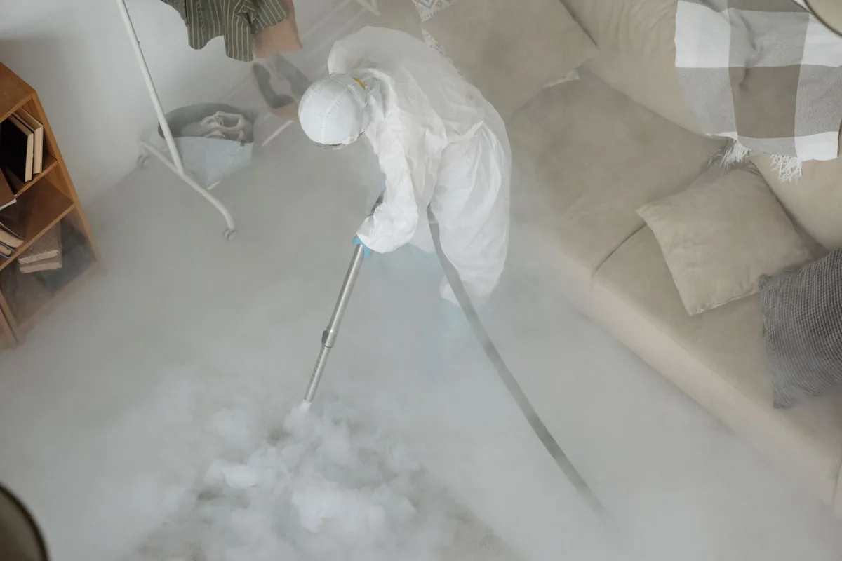 Biohazard cleanup technician in protective equipment, Winchester, MO